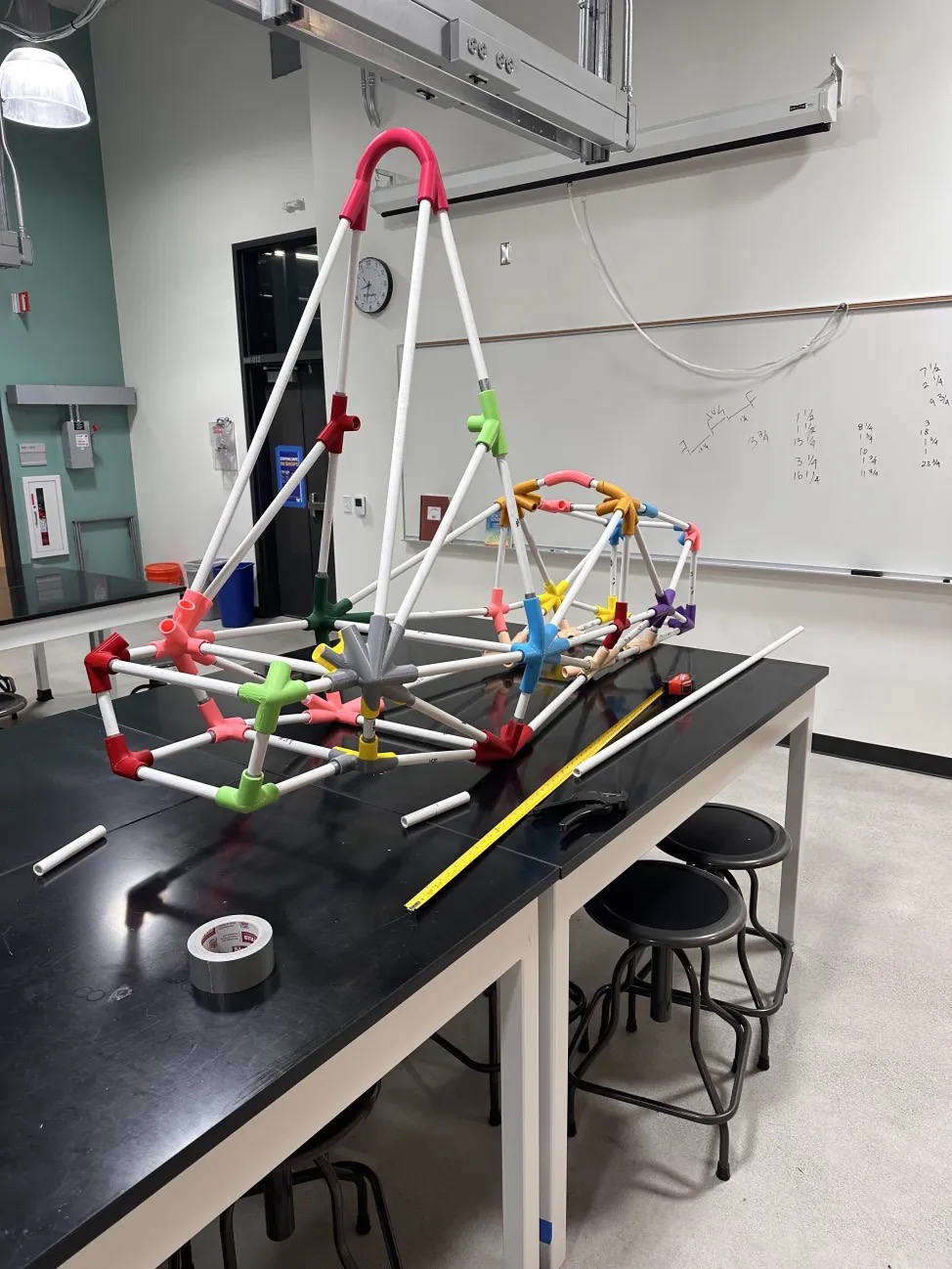 A race car structure, pipes linked by colorful connectors.