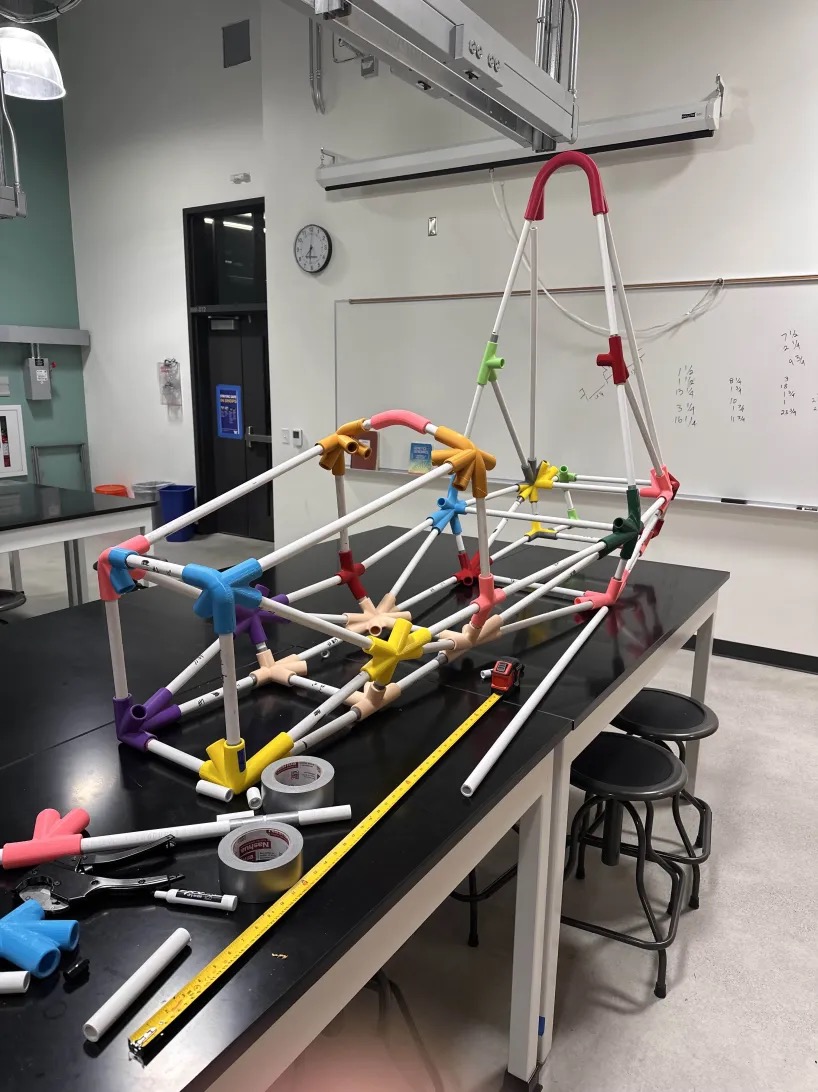 A race car structure, pipes linked by colorful connectors.