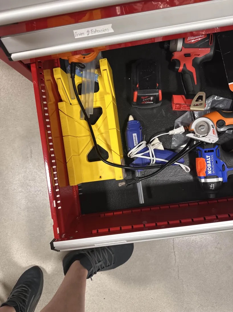 A drawer full of tools.